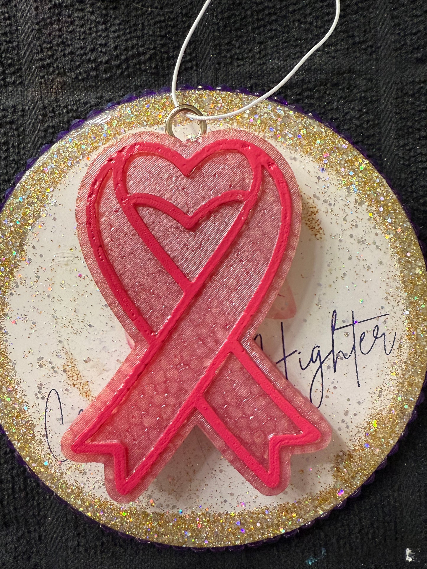 ^Car freshener. “survivor ribbon”
